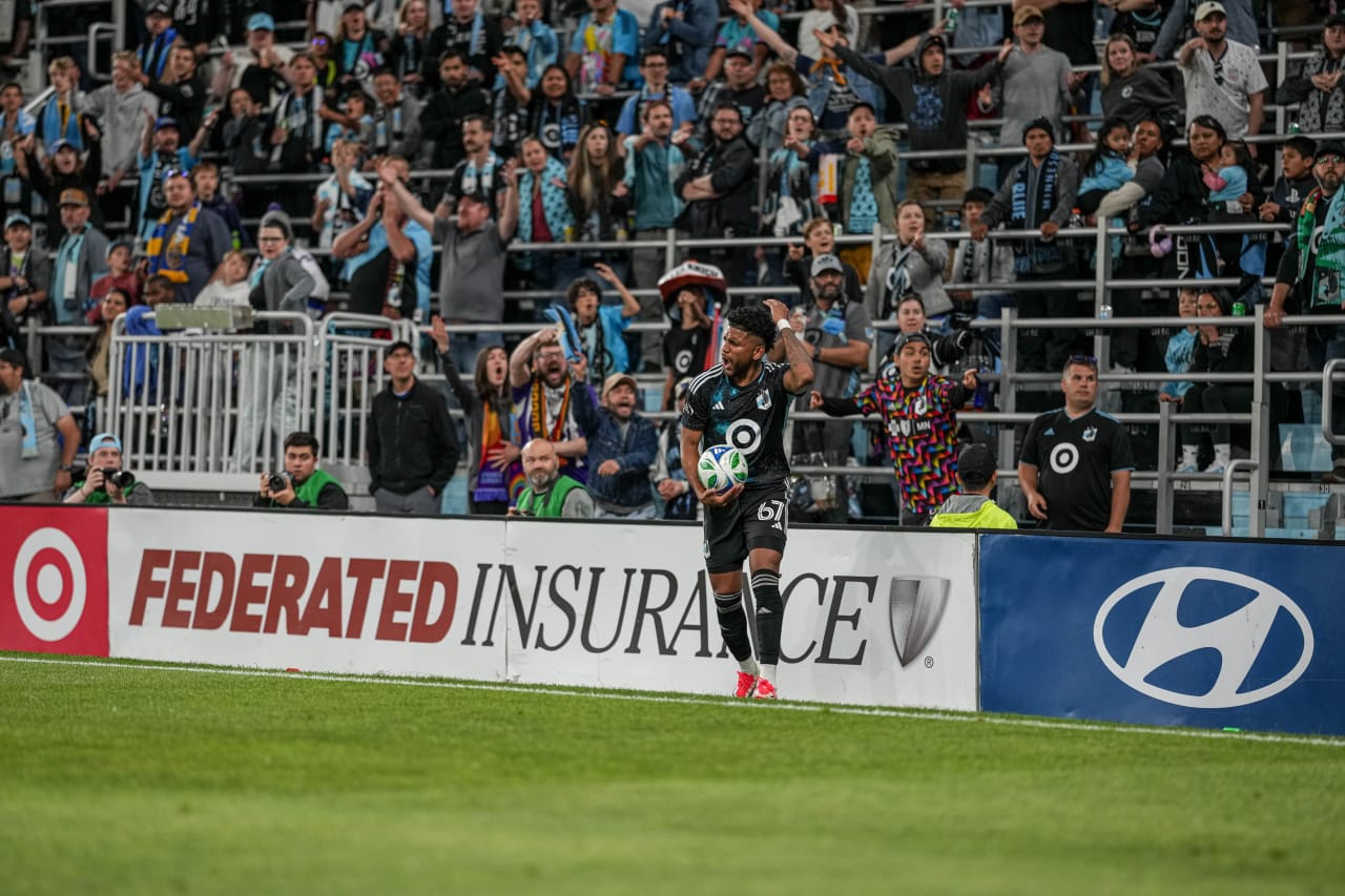 Carlos Harvey Raises His Arm in Frustration at the Officiating